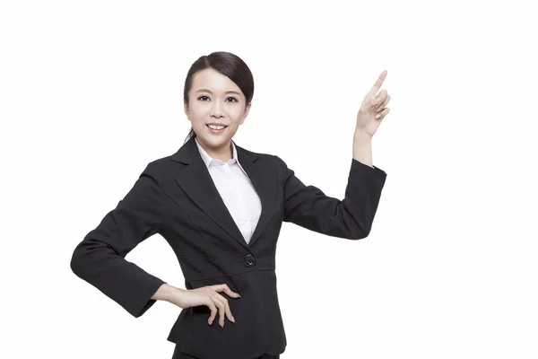 Portrait of young business woman pointing something — Stock Photo, Image