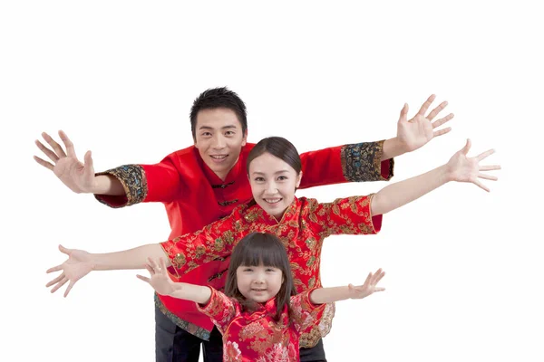 Portrait of daughter with parents in Tang suits opening arms — Stock Photo, Image