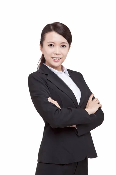 Portrait of young businesswoman standing folding arms — Stockfoto