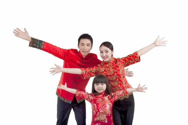 Portrait of daughter with parents in Tang suits opening arms — Stock Photo, Image