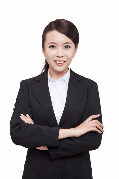 Portrait of young businesswoman standing folding arms — Stockfoto