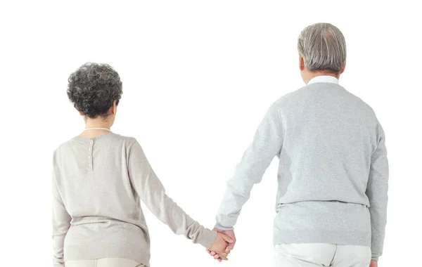 Orientální starý pár drží za ruce — Stock fotografie