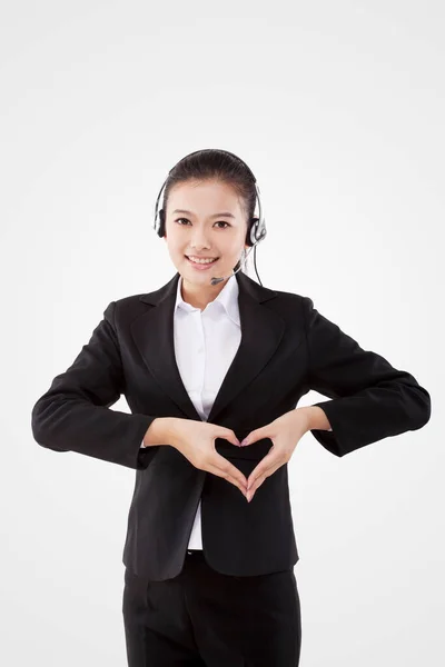 Oriental senhora de negócios vestindo fone de ouvido — Fotografia de Stock