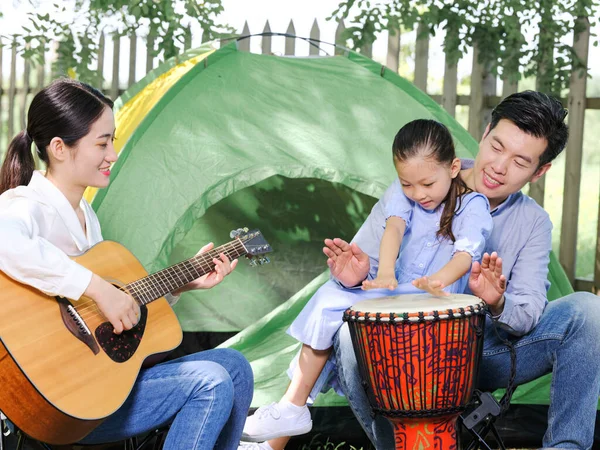 A Happy family of three camping outdoors — Stock Photo, Image