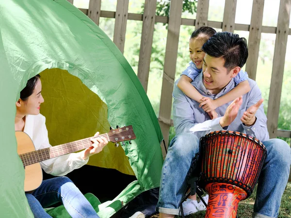 A Happy family of three camping outdoors — Stock Photo, Image