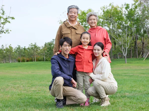 Happy family of five in the park