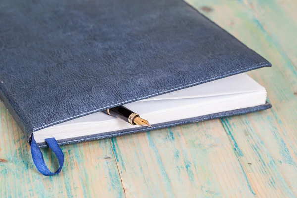 Selective focus of the  pen on opened lined diary book , — Stock Photo, Image