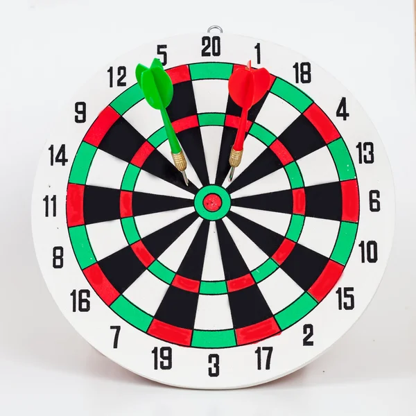 Dart arrow hitting in bullseye on dartboard — Stock Photo, Image
