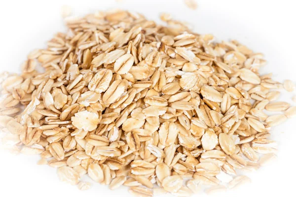 Oats flakes pile on white background — Stock Photo, Image