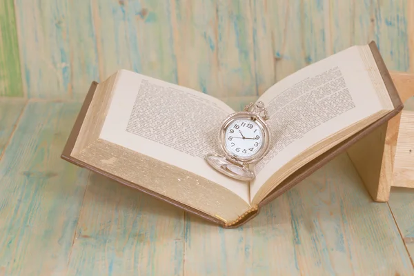 Pocket Watch over Age Book Background ,Time — Stock Photo, Image