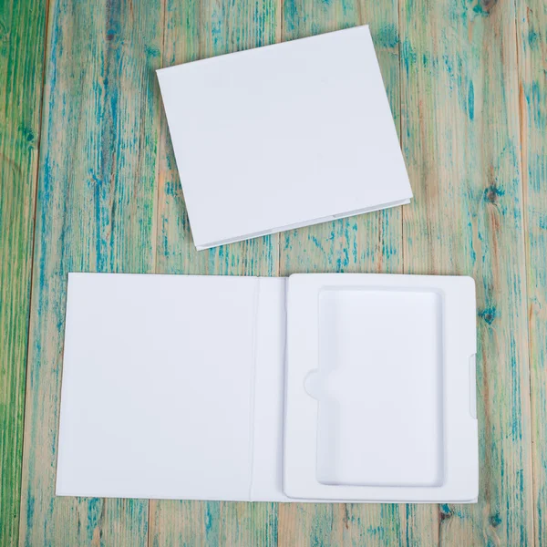 Blank white box mock up on wood — Stock Photo, Image