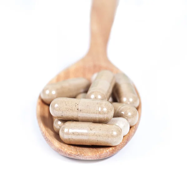 Capsules of herbs on spoon. healthy eating for healthy — Stock Photo, Image