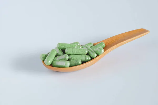 Herbal Capsules Wooden Spoon Herb Leaf White — Stock Photo, Image