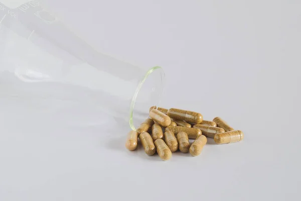 Medical Concept Science Bottle Scattered Herb Capsule Pills — ストック写真