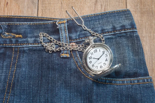 Pocket watch in pocket of jeans — Stock Photo, Image