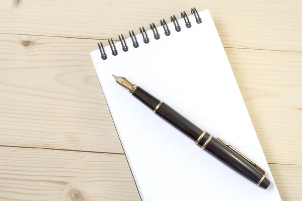 Blank notebook and fountain pen on wooden — Stock Photo, Image