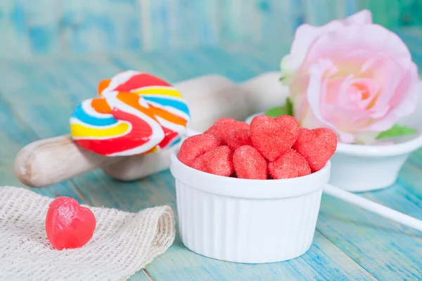 Heart candies coated with sugar in white cup.selective focus. — Stock Photo, Image