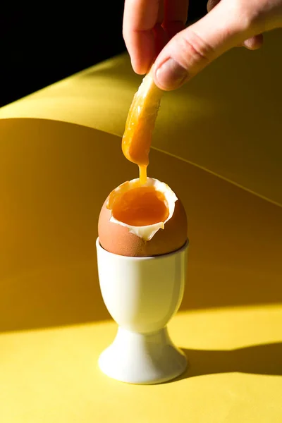 soft-boiled egg on a yellow background