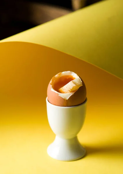 soft-boiled egg on a yellow background