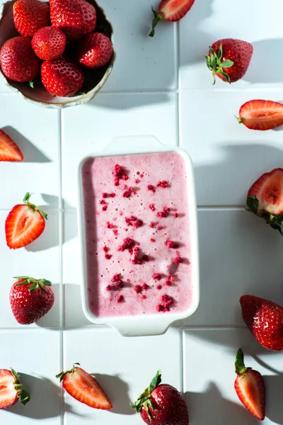 Strawberry ice cream in a white container — Stock Photo, Image