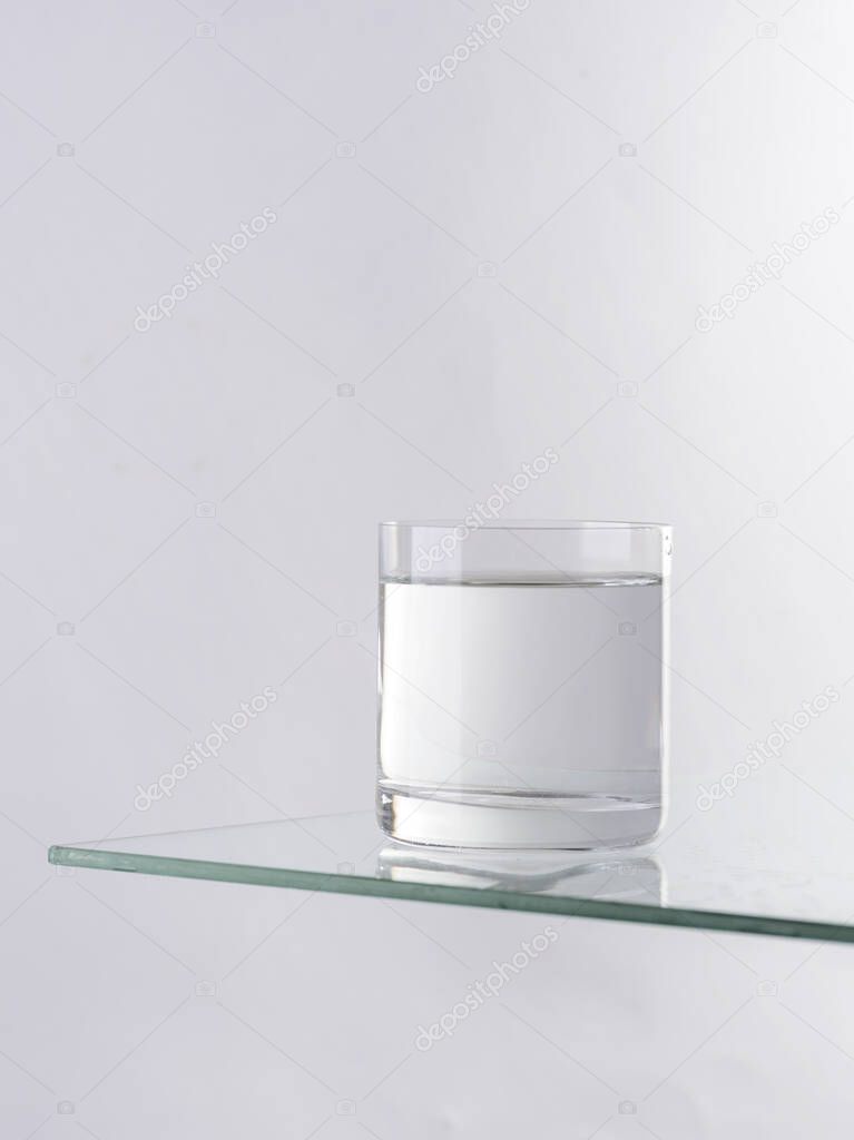 a glass of water on a white background