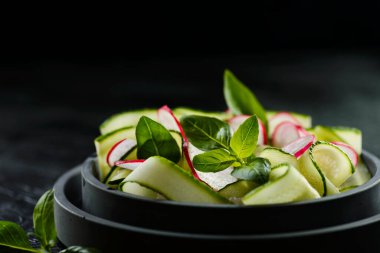cucumber and radish salad on a plate