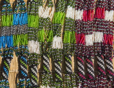 African unique traditional handmade colorful beads necklaces. Local craft market in South Africa. clipart