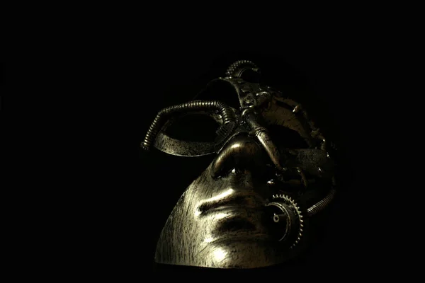 Iron mask on a black background.