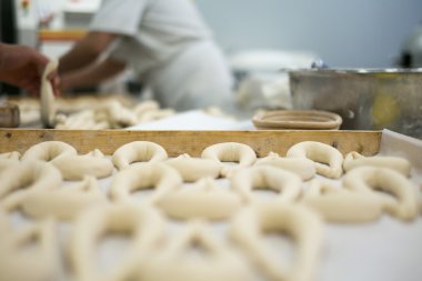 Bakers Preparing Fresh Pretzel Dough on Tray