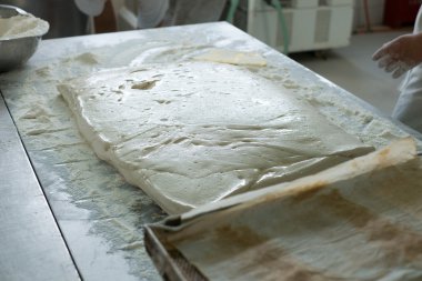 Baker Prepping a Flat of Ciabatta Dough