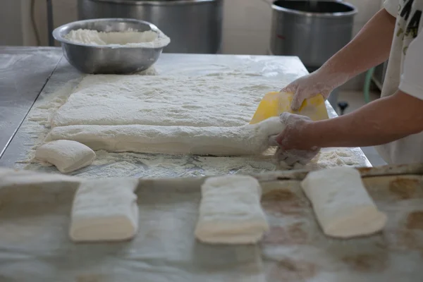 Baker Cutting Raw Ciabatta Bread Dough — Φωτογραφία Αρχείου