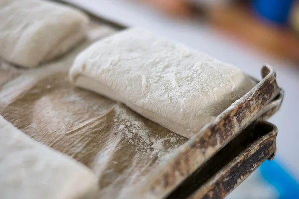 Yummy Fresh Raw Ciabatta Loaf on Tray — Stockfoto