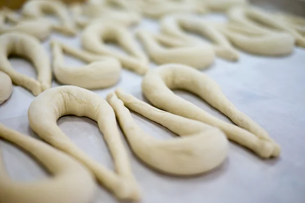 Fresh Pretzel or Brezel Dough on Wax Tray — Stock fotografie