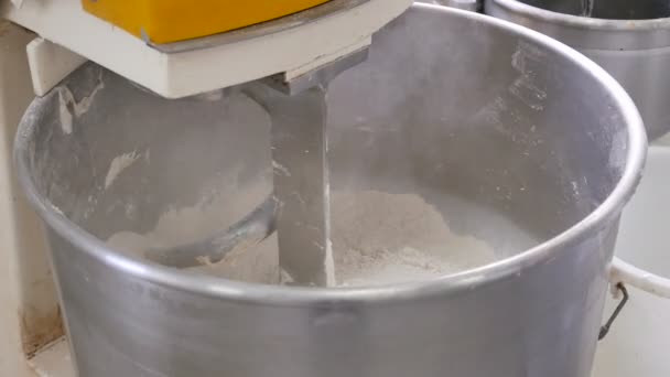 Baker Adding Flour To A Bread Making Machine — Stock Video