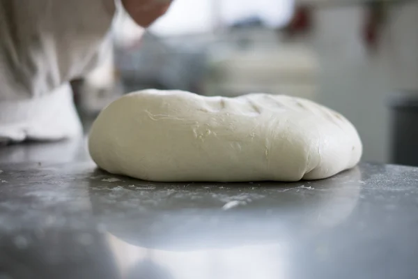 Baker Steping up to  Fresh Bread Dough — Stock Photo, Image