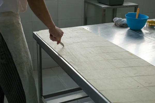 Cutting Raw Croissant Dough — Stock Photo, Image