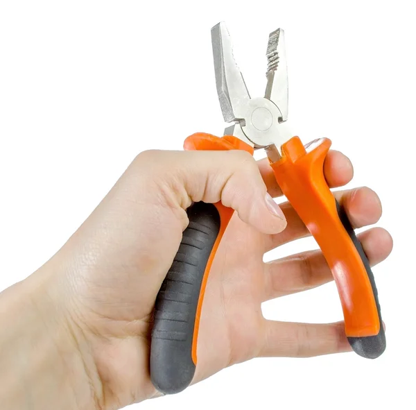 Pliers in hand — Stock Photo, Image