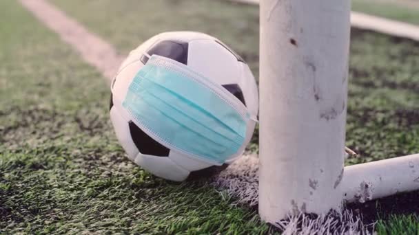Black White Soccer Ball Medical Mask Lying Soccer Goal Порожній — стокове відео