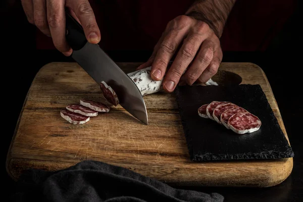 Cutting salchichon, dark food style