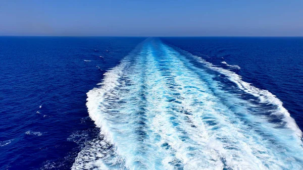 View of the wake of a cruise ship in the ocean. Perfect for any use.