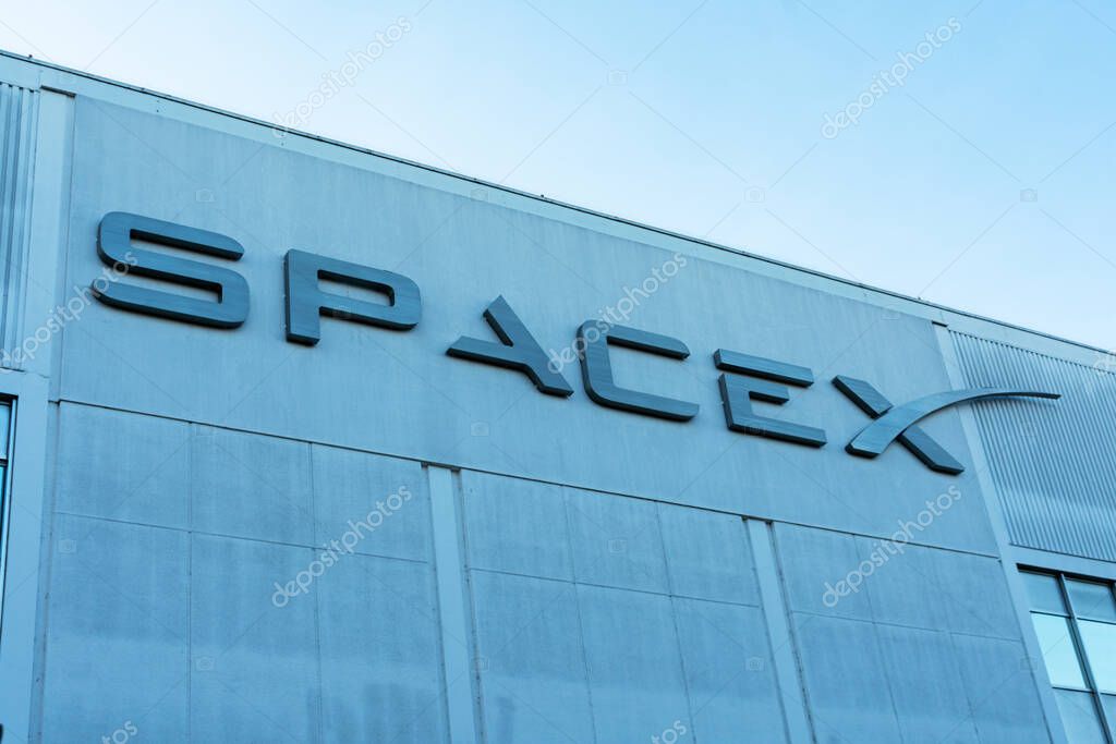 SpaceX sign logo on Space Exploration Technologies Corp headquarters building. SpaceX is private American aerospace manufacturer - Hawthorne, California, USA - 2020