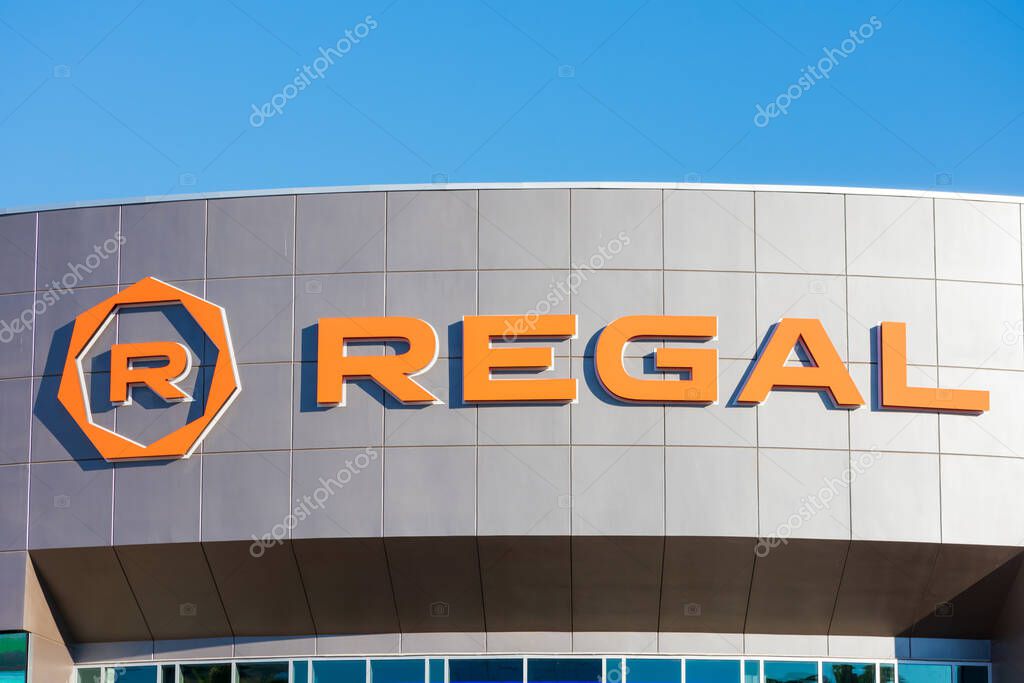 Regal logo sign on facade of the movie theater. Regal Cinemas is an American movie theater chain - Irvine, California, USA - 2020