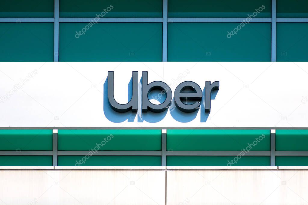 Uber sign and logo at offices in Silicon Valley. San Francisco based Uber Technologies is an American multinational ride-hailing company - Sunnyvale, California, USA - 2020