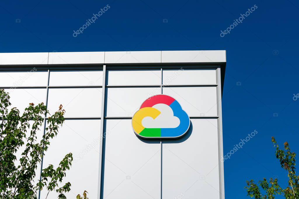 Google Cloud logo in the shape of cloud is displayed on Google campus building. The colors found in the logo are blue, red, yellow and green. - Sunnyvale, California, USA - 2020