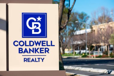 Coldwell Banker Realty sign at residential brokerage office. Coldwell Banker Real Estate LLC is an American real estate company franchise owned by Realogy. - San Jose, California, USA - 2020 clipart