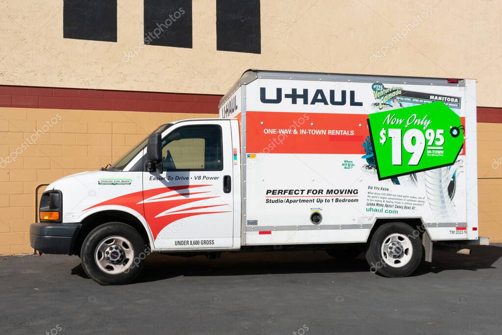 Side view of parked U-Haul 10 foot moving truck. U-Haul is an American moving equipment and storage rental company - San Diego, California, USA - 2020