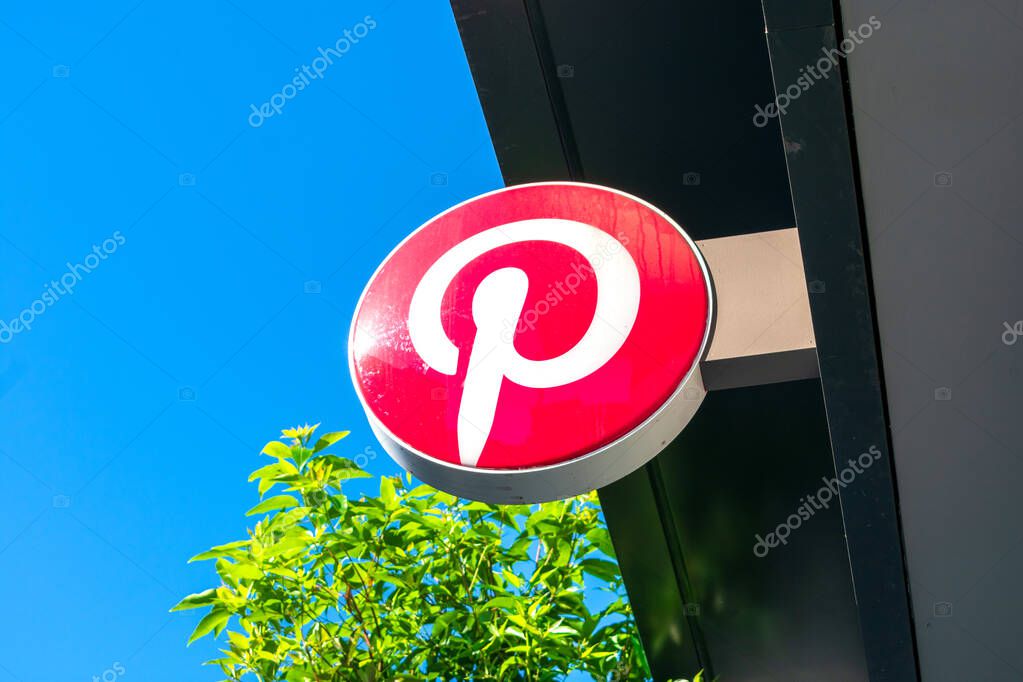 Pinterest logo on facade of social media startup headquarters campus building - San Francisco, California, USA - 2021