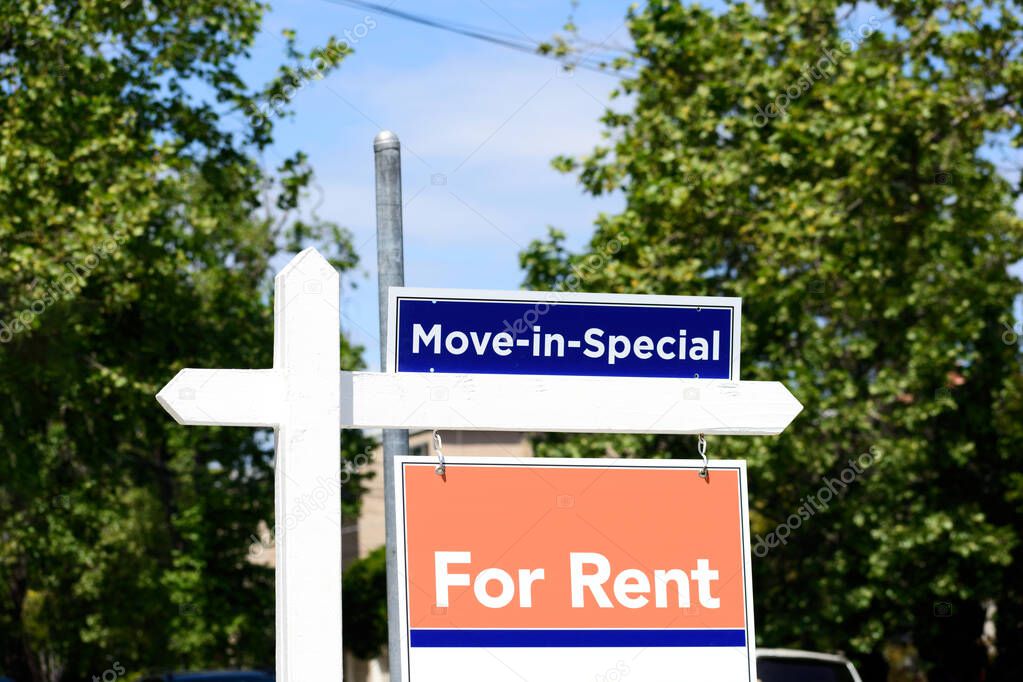 Move In Special and For Rent real estate signs advertise enticing incentive for apartment, condo or home renter.