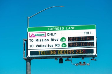 FasTrak Only Express Lane sign. FasTrak is an electronic toll collection ETC system on toll roads, bridges, and high-occupancy toll lanes in California. - Fremont, California, USA - 2021 clipart