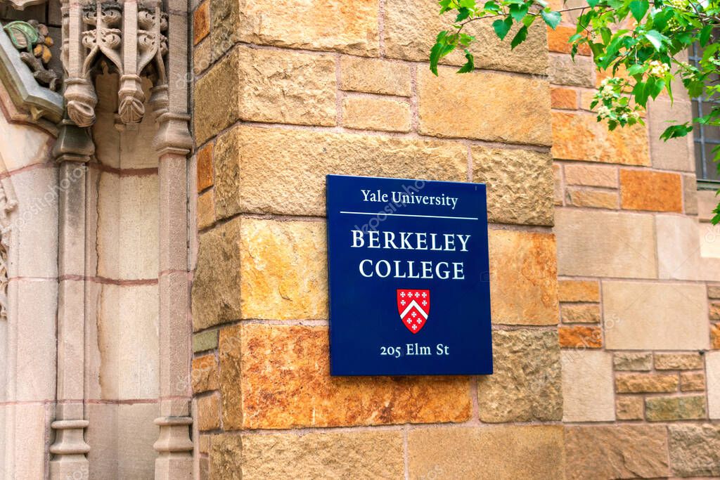 Yale University. Berkeley College sign and coat of arms on historic building 205 Elm Street. - New Haven, Connecticut, USA - 2021